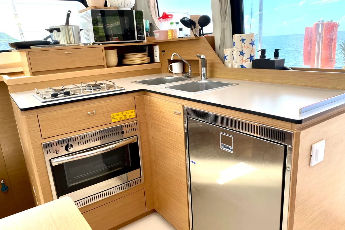 Galley of OLOKUM Mallorca BAREBOAT, a Excess 11 catamaran at Port d'Andratx, Spain
