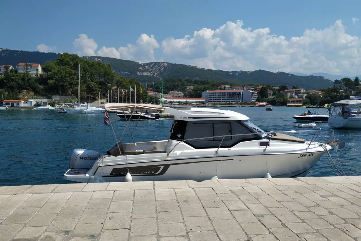 Exterior view of MF 795, a Jeanneau Merry Fisher 795 motorboat at Punat, Croatia