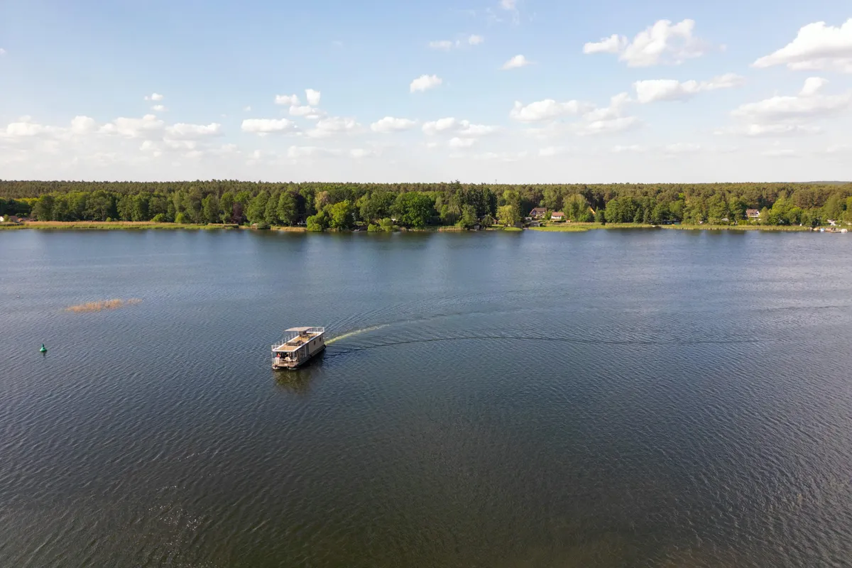 Exterior view of Emsel, a Woma D13 motorboat at Fürstenberg/Havel, Germany