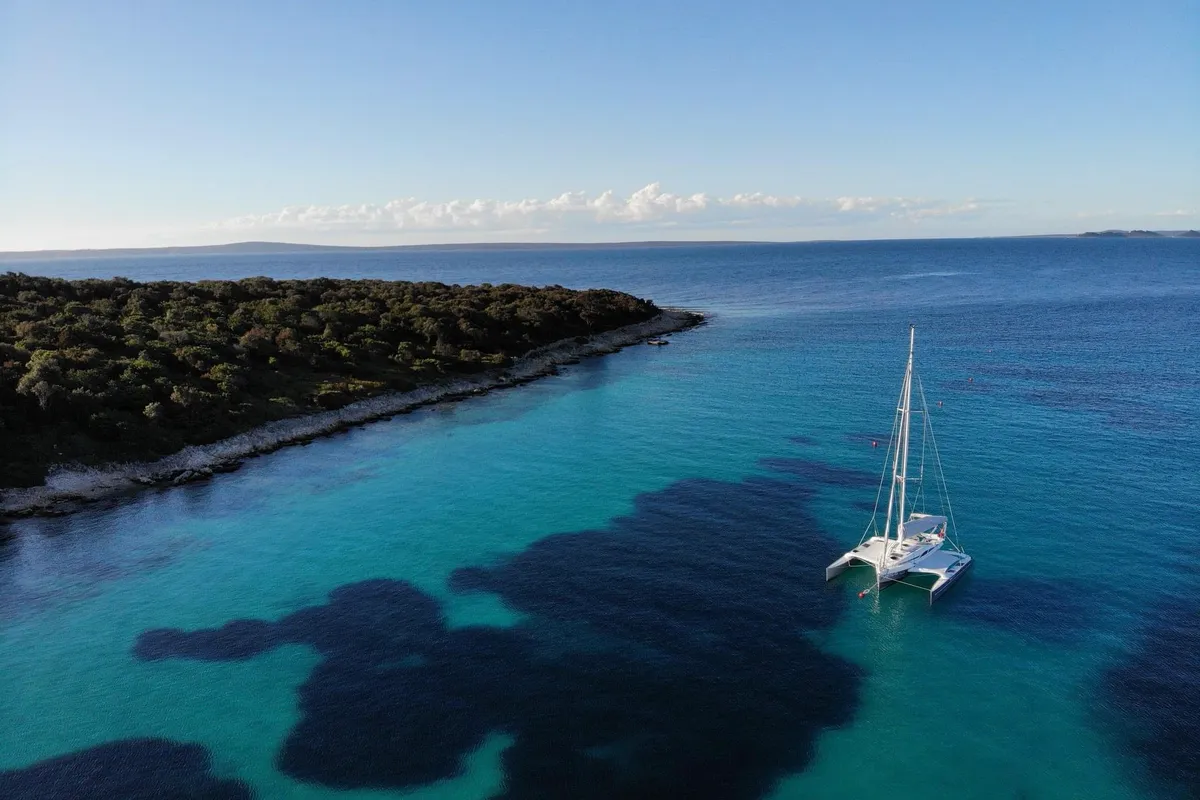 Exterior view of Gulet Trimaran, a sailboat at Duino Aurisina, Italy