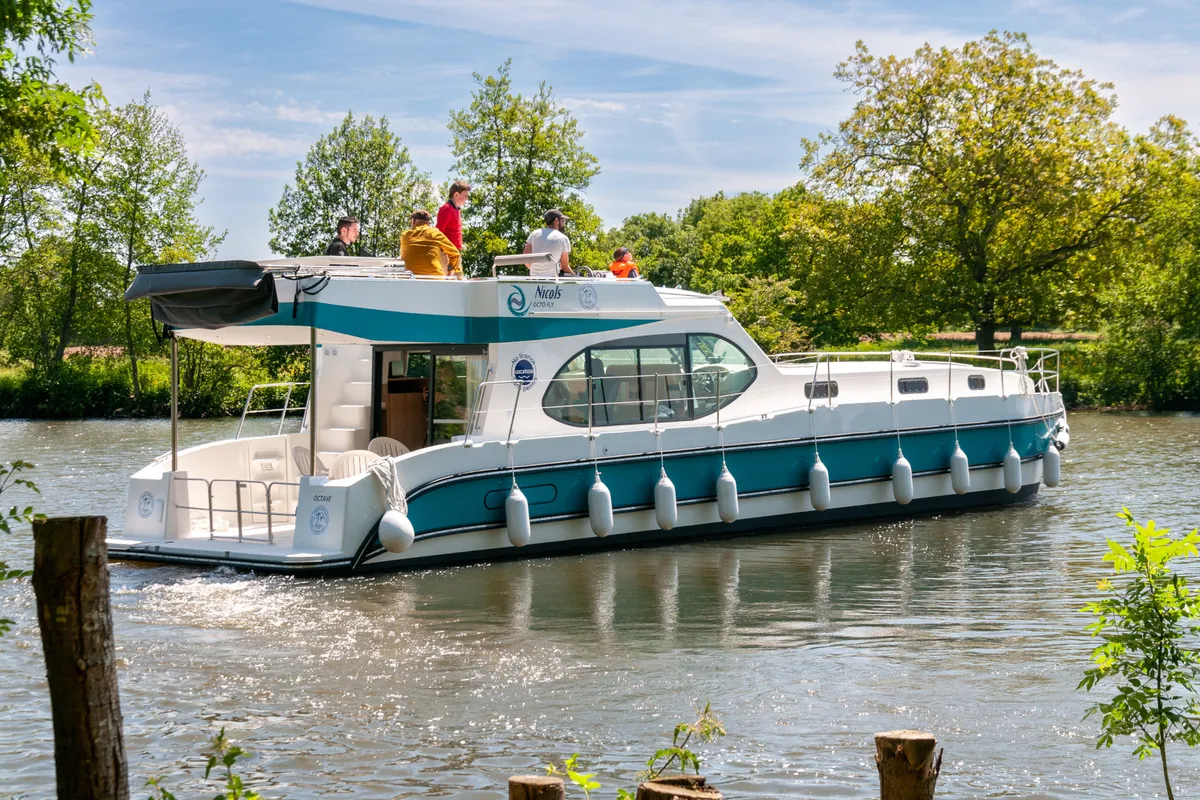 Exterior view of Orchestra, a Nicols Octo Fly 12 motorboat at Grez-Neuville, France