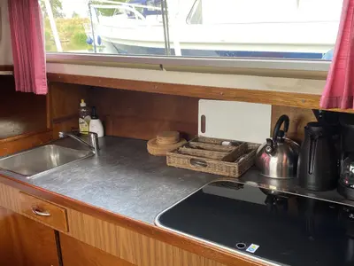 Galley of Haedi, a Courtevenne 830 motorboat at Heukelum, Netherlands
