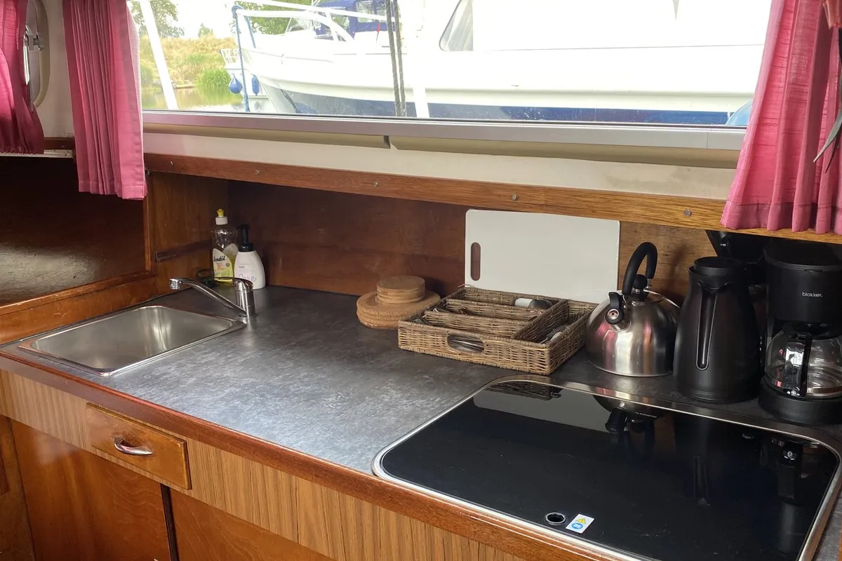 Galley of Haedi, a Courtevenne 830 motorboat at Heukelum, Netherlands