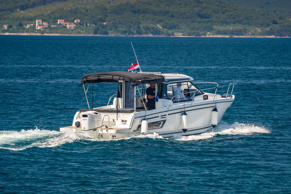 Exterior view of Klapa, a Jeanneau Merry Fisher 795 motorboat at Municipality of Novigrad, Croatia