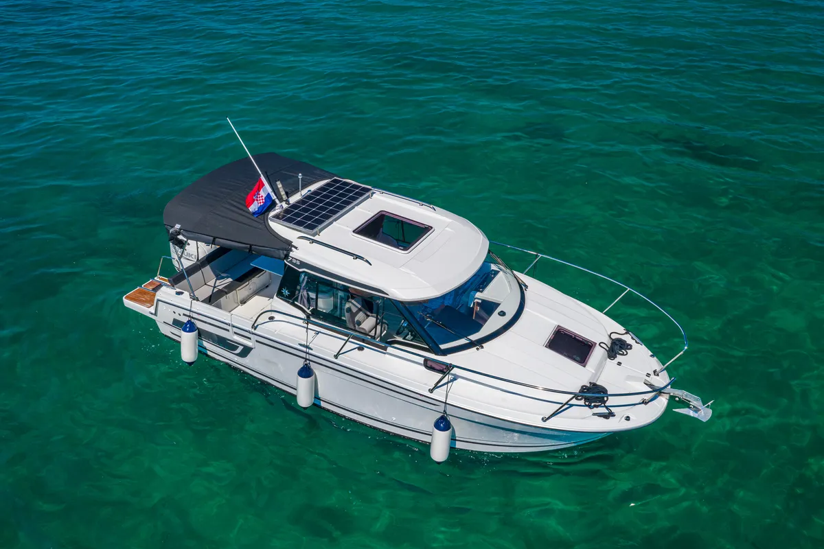 Exterior view of Klapa, a Jeanneau Merry Fisher 795 motorboat at Municipality of Novigrad, Croatia