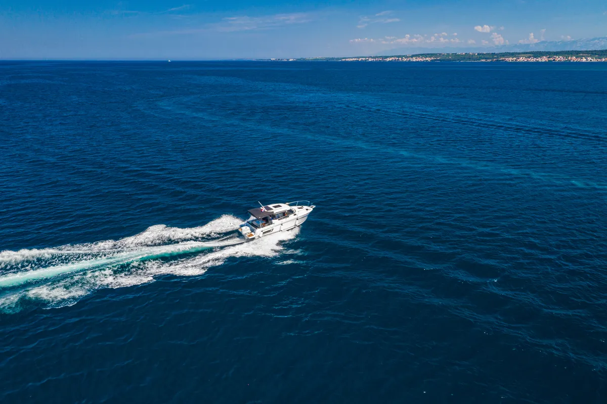 Exterior view of Klapa, a Jeanneau Merry Fisher 795 motorboat at Municipality of Novigrad, Croatia