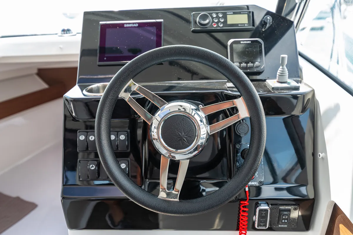 Cockpit of Klapa, a Jeanneau Merry Fisher 795 motorboat at Municipality of Novigrad, Croatia