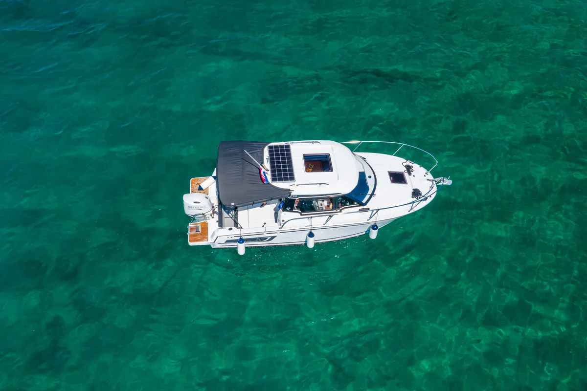 Exterior view of Klapa, a Jeanneau Merry Fisher 795 motorboat at Municipality of Novigrad, Croatia