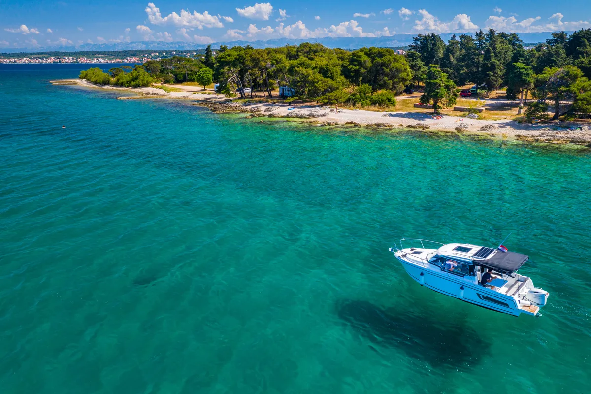 Exterior view of Klapa, a Jeanneau Merry Fisher 795 motorboat at Municipality of Novigrad, Croatia