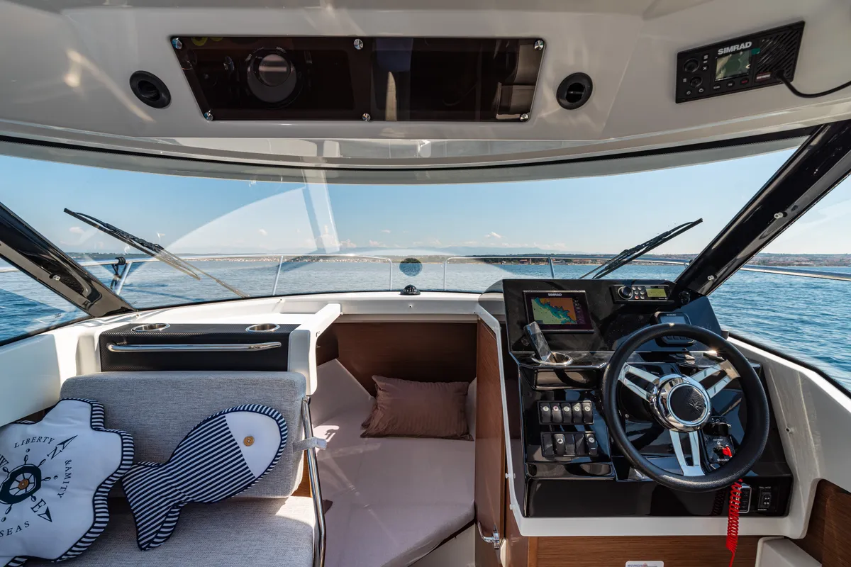 Cockpit of Klapa, a Jeanneau Merry Fisher 795 motorboat at Municipality of Novigrad, Croatia