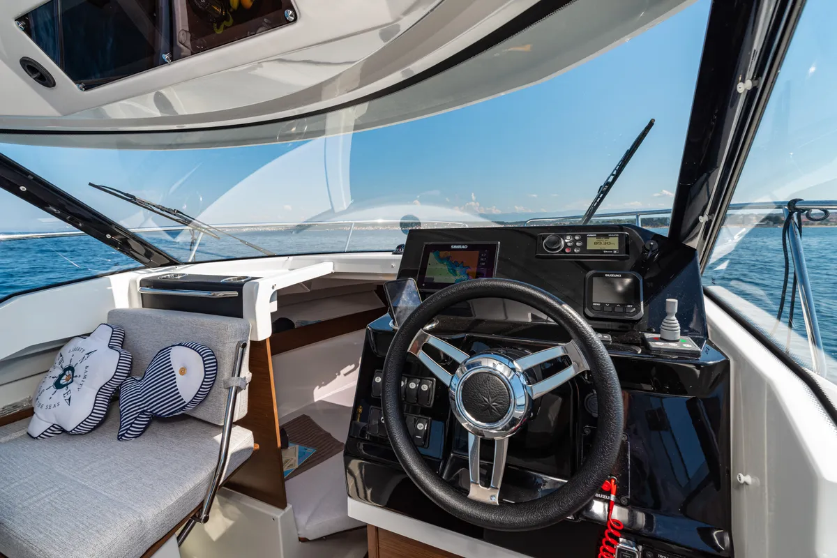 Cockpit of Klapa, a Jeanneau Merry Fisher 795 motorboat at Municipality of Novigrad, Croatia