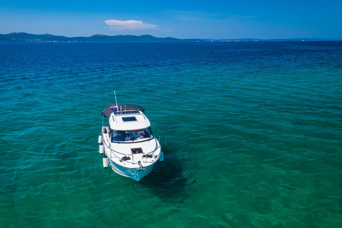 Exterior view of Klapa, a Jeanneau Merry Fisher 795 motorboat at Municipality of Novigrad, Croatia