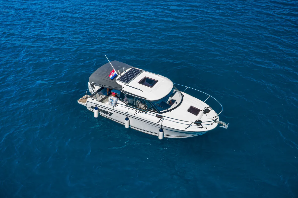 Exterior view of Klapa, a Jeanneau Merry Fisher 795 motorboat at Municipality of Novigrad, Croatia