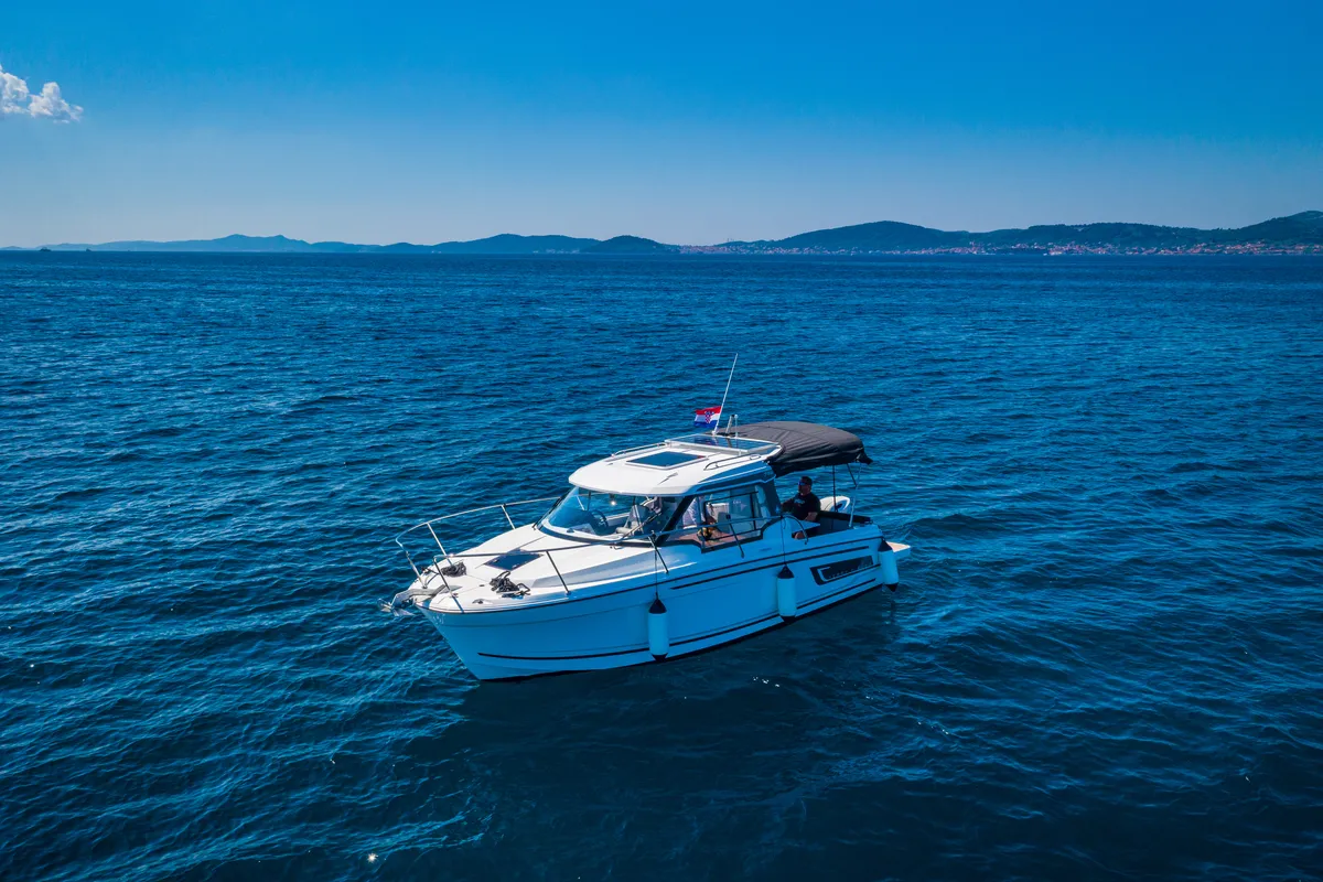 Exterior view of Klapa, a Jeanneau Merry Fisher 795 motorboat at Municipality of Novigrad, Croatia