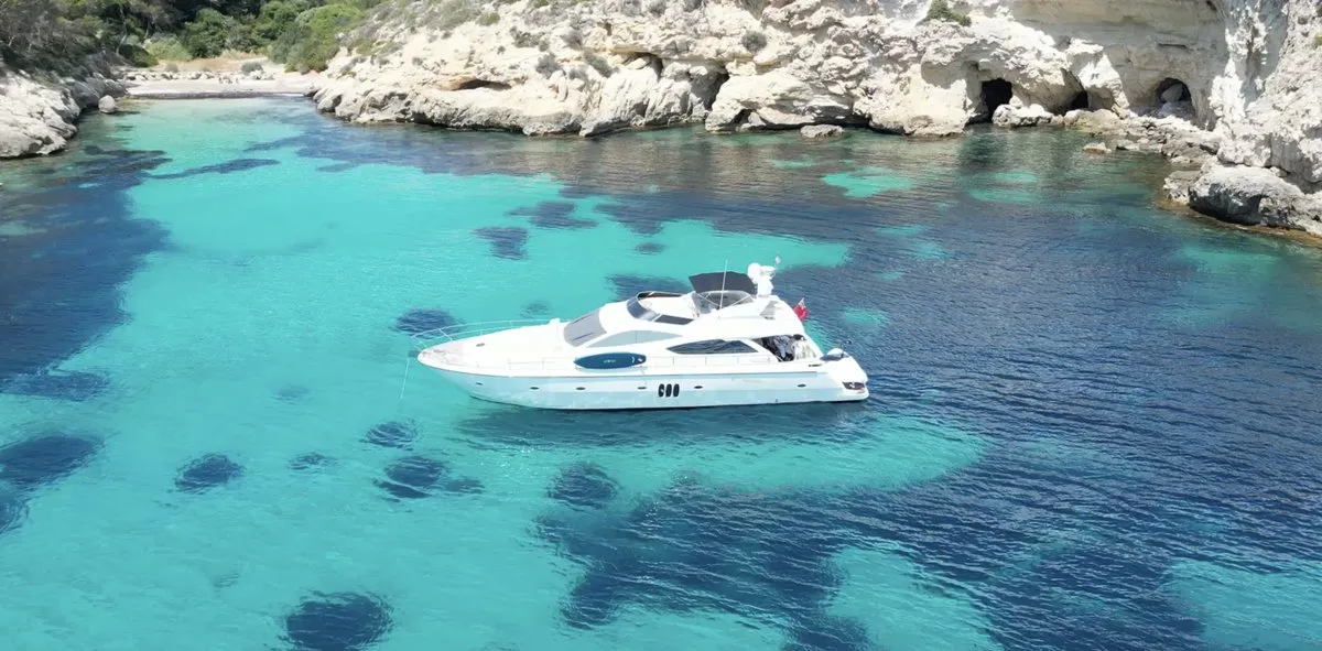 Exterior view of Auri, a Abacus 70 motor yacht at Port d'Andratx, Spain