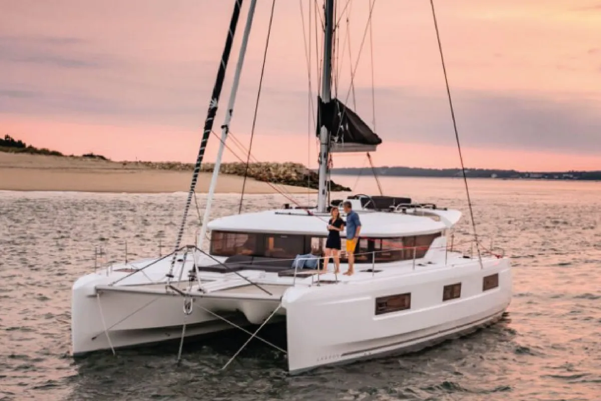 Exterior view of silver elli, a Lagoon 46 catamaran at Sant Antoni de Portmany, Spain