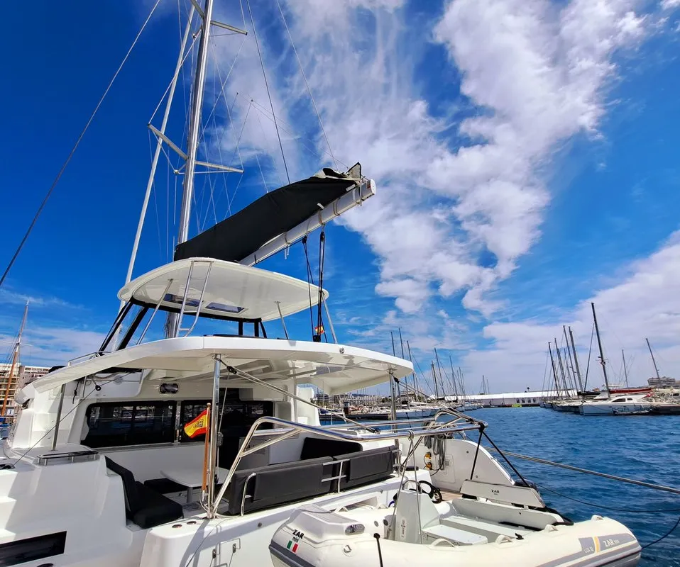Exterior view of silver elli, a Lagoon 46 catamaran at Sant Antoni de Portmany, Spain