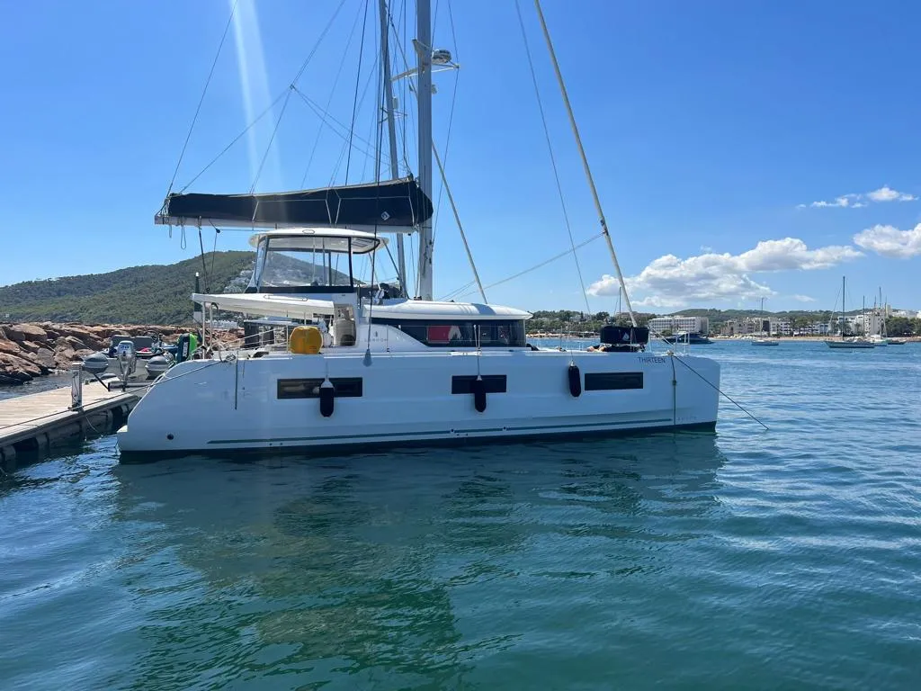 Exterior view of Keep, a Lagoon 46 catamaran at Sant Antoni de Portmany, Spain