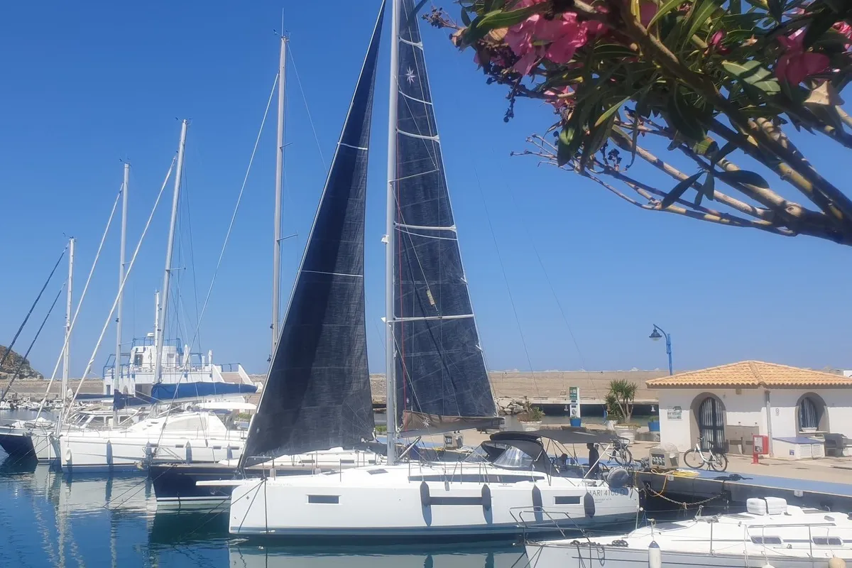 Exterior view of The Song Is You, a Jeanneau Sun Odyssey 410 sailboat at Tropea, Italy