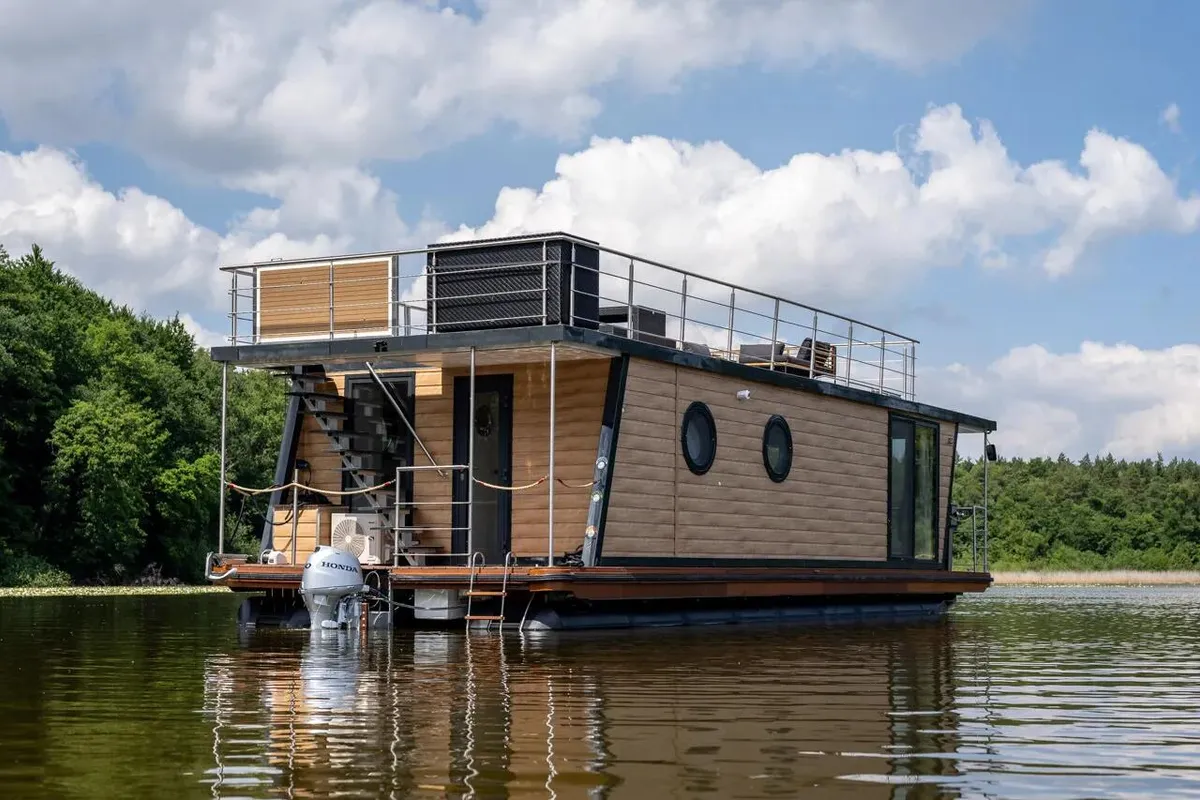 Exterior view of Enjoy, a Woma D13* motorboat at Fürstenberg/Havel, Germany