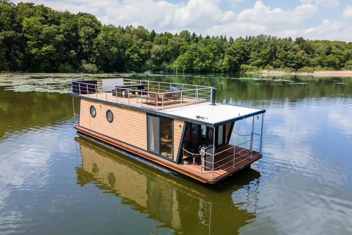 Exterior view of Enjoy, a Woma D13* motorboat at Fürstenberg/Havel, Germany