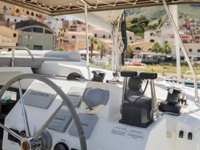 Cockpit of Premium, a Fountaine Pajot Saona 47 catamaran at Castellammare del Golfo, Italy