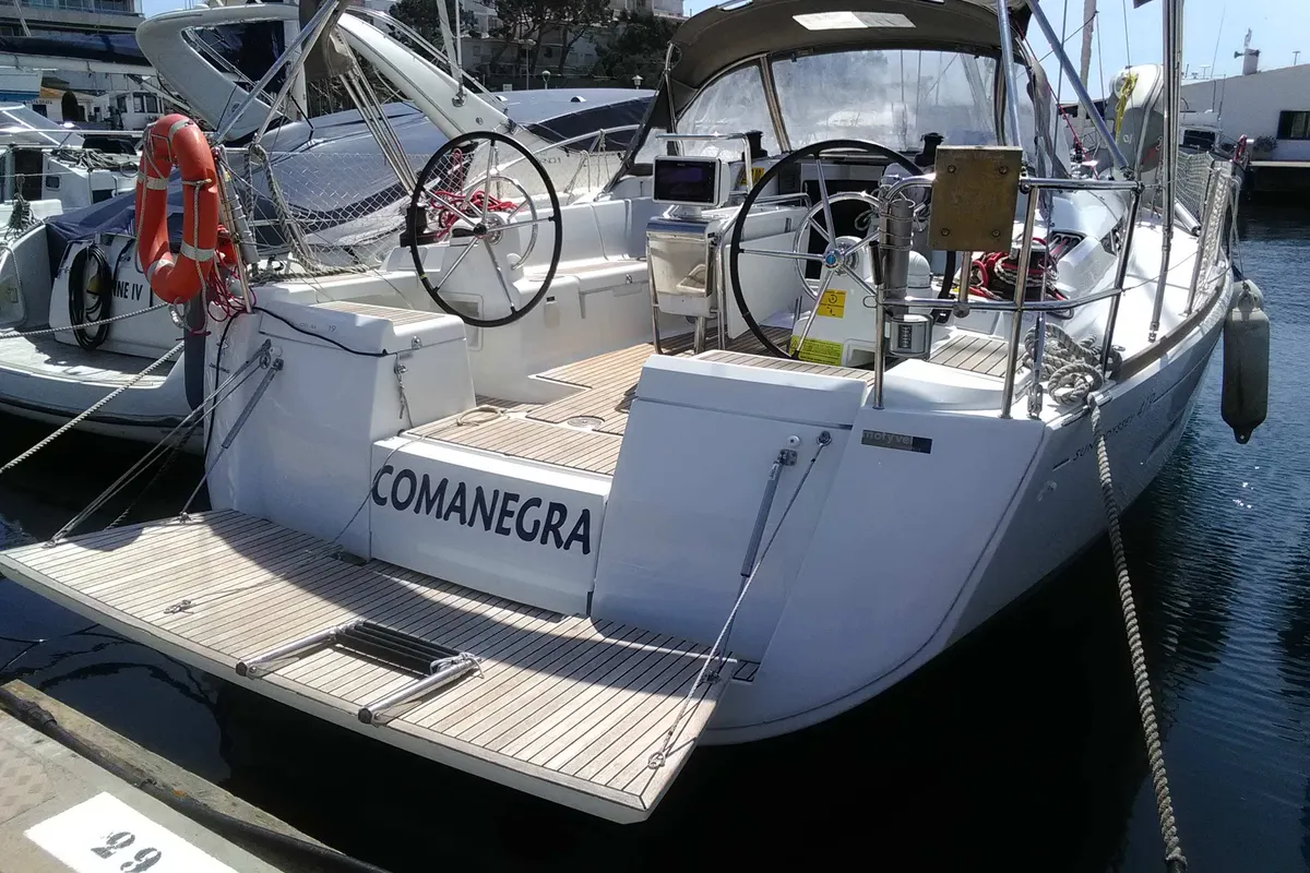Exterior view of Comanegra, a Jeanneau Sun Odyssey 419 sailboat at Palamós, Spain