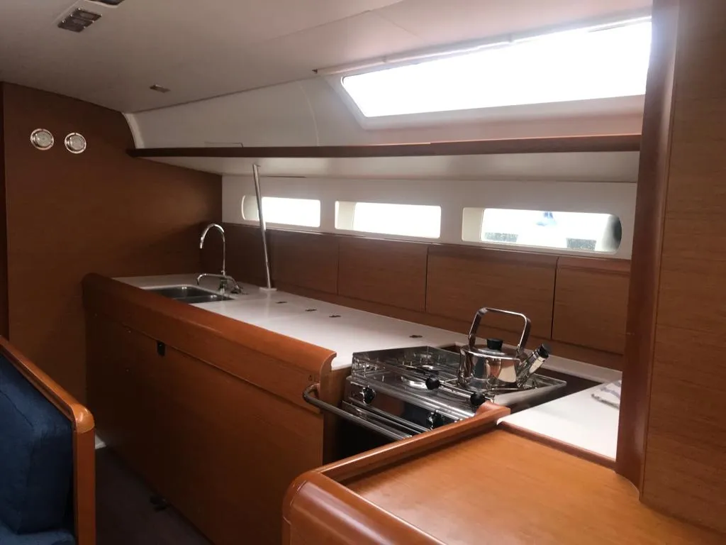 Galley of Alboran Grappa, a Jeanneau Sun Odyssey 519 sailboat at es Jonquet, Spain
