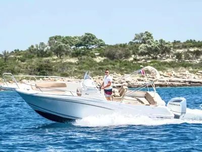 Exterior view of Cap Camarat, a Jeanneau Cap Camarat 7.5 CC motorboat at Trogir, Croatia