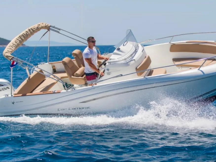 Exterior view of Cap Camarat, a Jeanneau Cap Camarat 7.5 CC motorboat at Trogir, Croatia