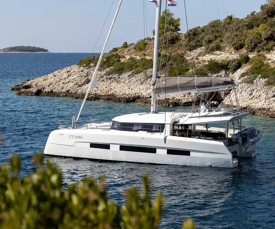 Exterior view of El Mar, a Dufour 48 Cat catamaran at Sant Antoni de Portmany, Spain