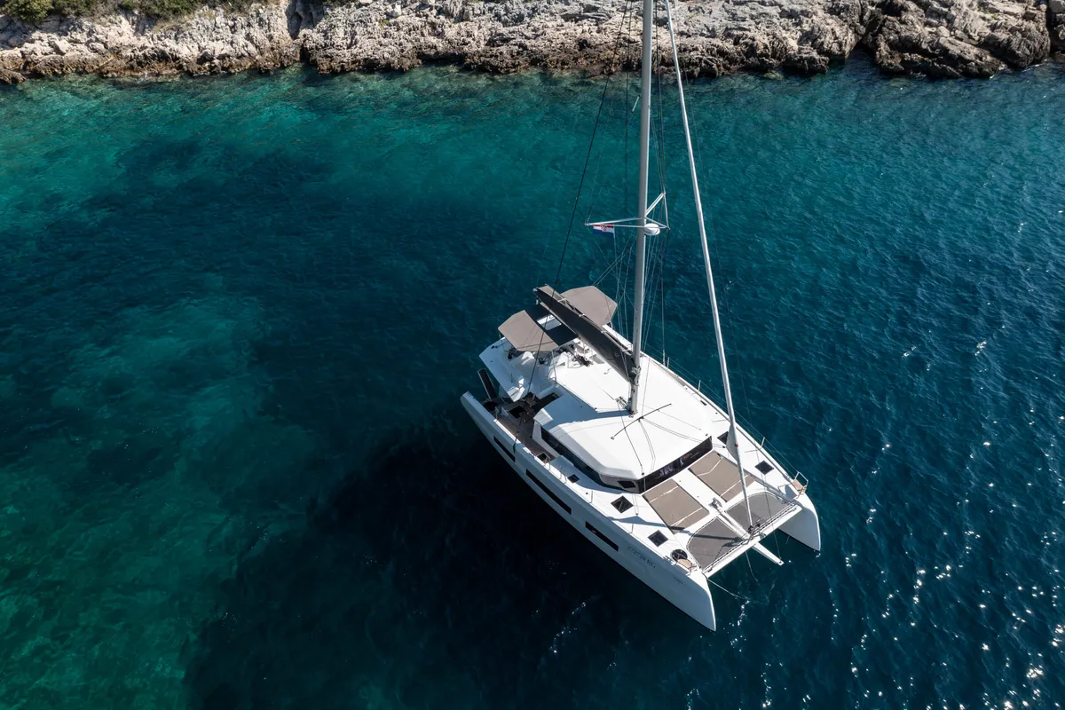 Exterior view of El Mar, a Dufour 48 Cat catamaran at Sant Antoni de Portmany, Spain