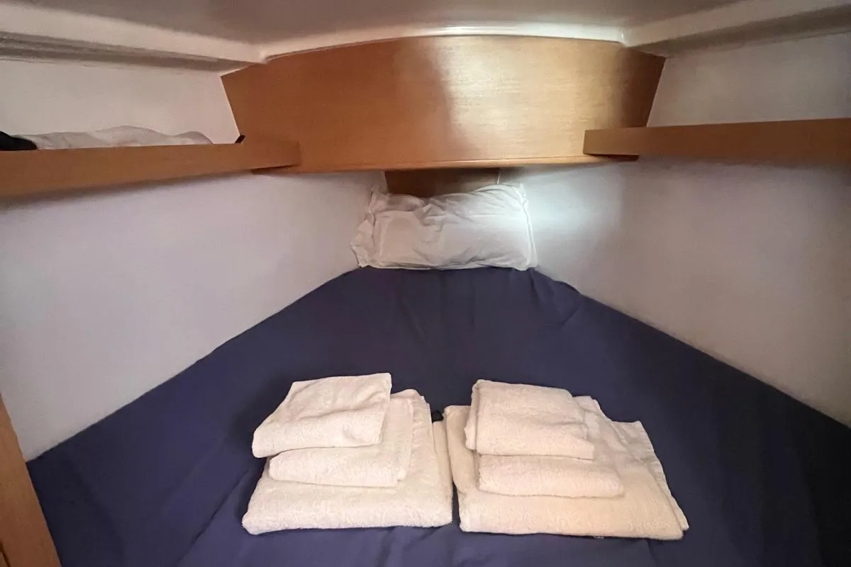 Cabin on Lazzarone, a Jeanneau Sun Odyssey 319 sailboat at Cannigione, Italy