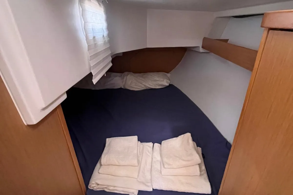 Cabin on Lazzarone, a Jeanneau Sun Odyssey 319 sailboat at Cannigione, Italy