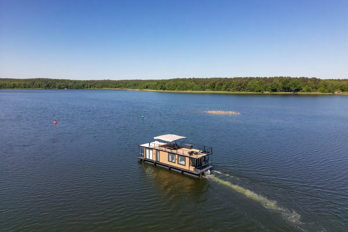 Exterior view of Pina, a Woma D13 motorboat at Fürstenberg/Havel, Germany