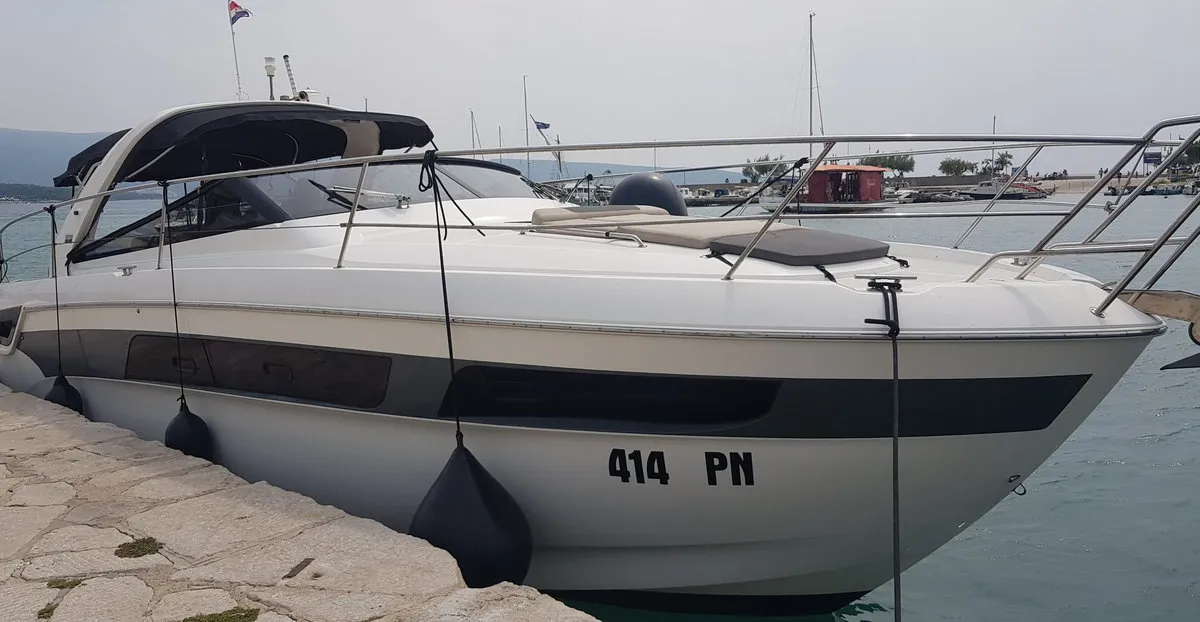 Exterior view of Rhea, a Bavaria Sport 400 Open motor yacht at Punat, Croatia