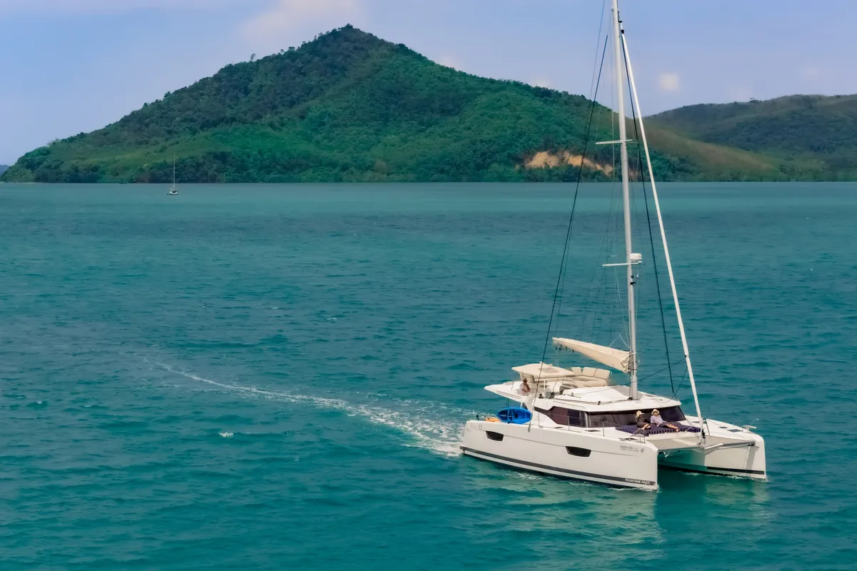Exterior view of Chammak Challo, a Fountaine Pajot Elba 45 catamaran at Mai Khao, Thailand