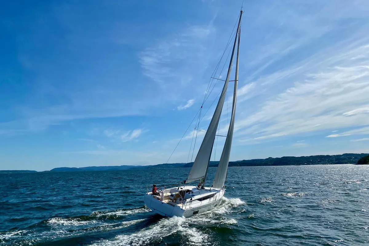 Exterior view of Ostwind II, a Bavaria C42 sailboat at Cala Egos, Spain