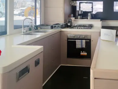 Galley of Danai, a Dufour 48 Catamaran catamaran at Agios Stefanos, Greece