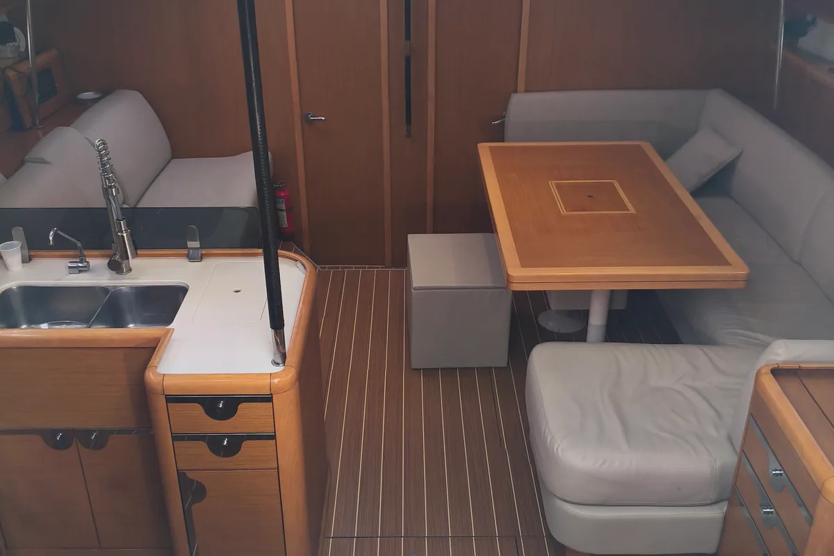 Salon of Keep Calm, a Jeanneau 53 sailboat at Olbia, Italy