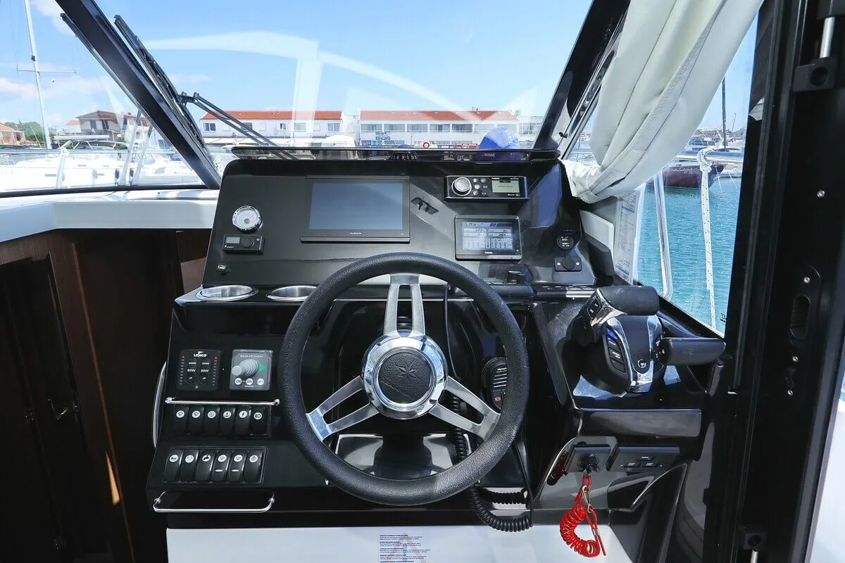 Cockpit of Tana, a Jeanneau Merry Fisher 1095 Fly motorboat at Pirovac, Croatia