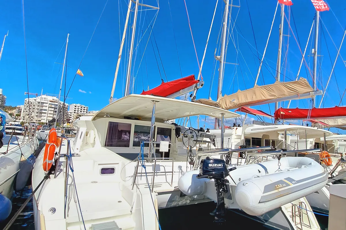 Exterior view of THE MOB, a Lagoon 421 catamaran at Sant Antoni de Portmany, Spain