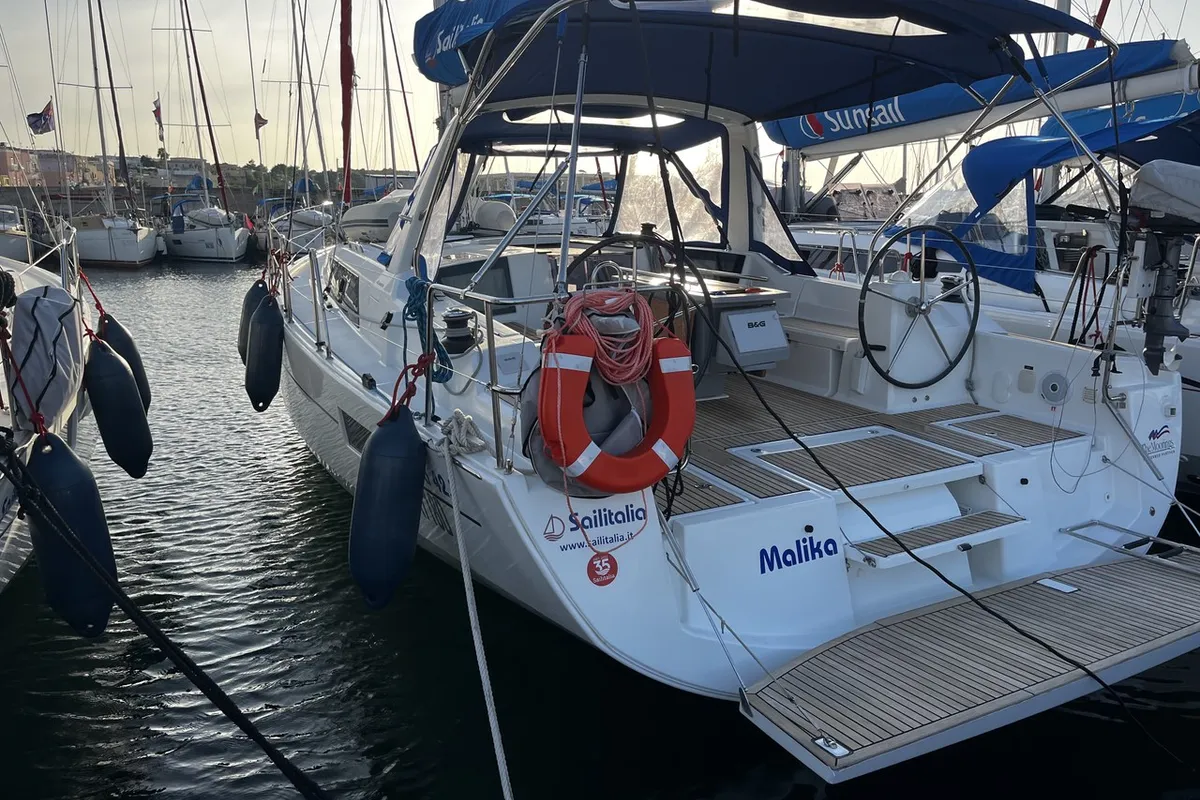 Exterior view of Malika, a Beneteau Oceanis 41.1 sailboat at Cannigione, Italy