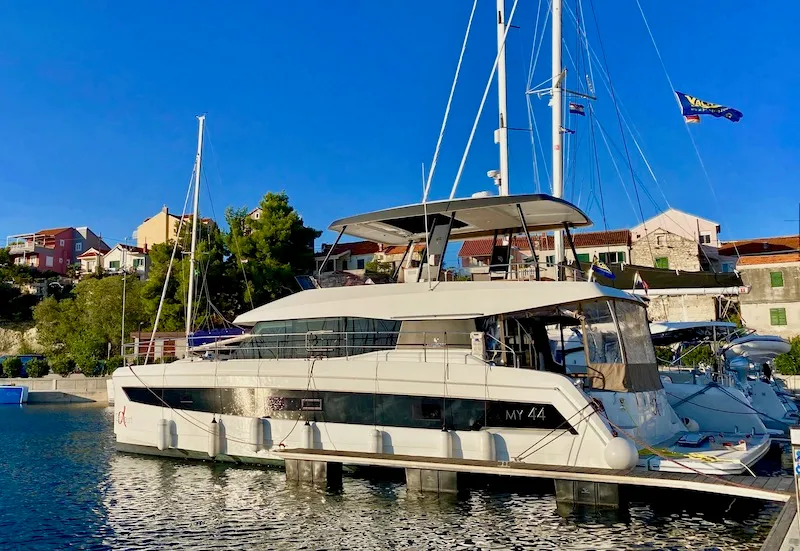 Exterior view of Alpha Centauri, a Fountaine Pajot MY44 catamaran at Grad Šibenik, Croatia