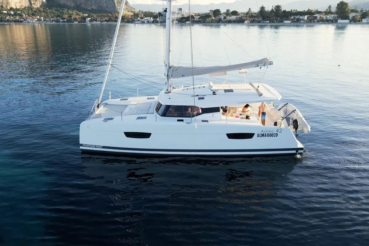 Exterior view of Rossa, a Fountaine Pajot Astrea 42 catamaran at Palermo, Italy