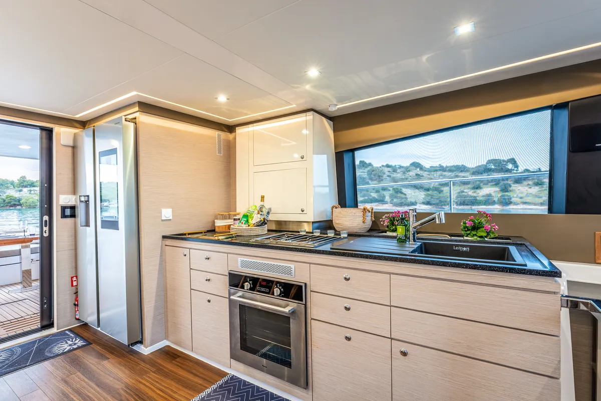 Galley of Nyd'amour II, a Aventura 14 Power catamaran at Kranidi, Greece