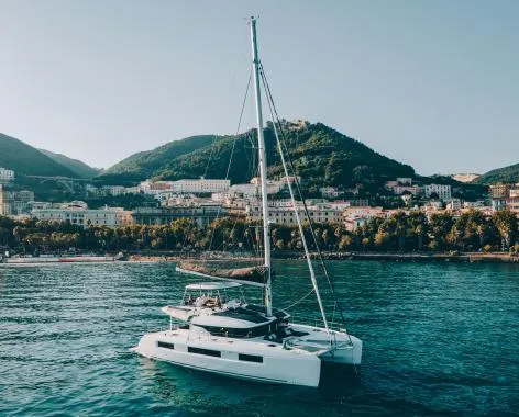 Exterior view of Lady G, a Lagoon 51 catamaran at Salerno, Italy