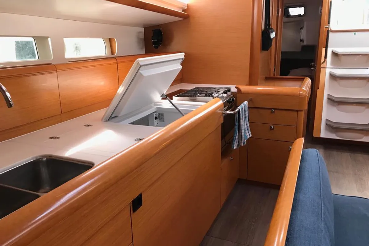 Galley of Alboran Cognac (Majorca), a Jeanneau Sun Odyssey 519 sailboat at es Jonquet, Spain