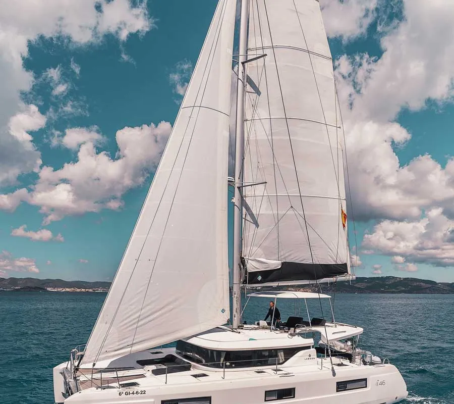 Exterior view of Invalid, a Lagoon 46 catamaran at Sant Antoni de Portmany, Spain