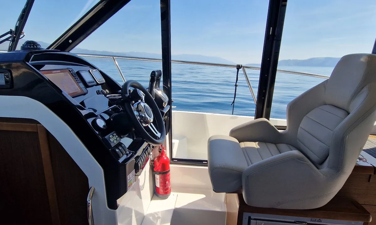 Cockpit of Whiskey, a Jeanneau Merry Fisher 895 motorboat at Novi Vinodolski, Croatia